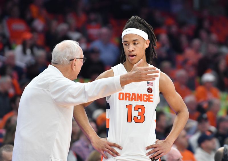 Feb 28, 2023; Syracuse, New York, USA; Syracuse Orange head coach Jim Boeheim has a word with forward Benny Williams (13) in the first half game against the Georgia Tech Yellow Jackets at the JMA Wireless Dome. Mandatory Credit: Mark Konezny-USA TODAY Sports