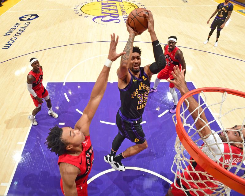 LOS ANGELES, CA - JANUARY 9: Christian Wood #35 of the Los Angeles Lakers drives to the basket during the game against the Toronto Raptors on January 9, 2024 at Crypto.Com Arena in Los Angeles, California. NOTE TO USER: User expressly acknowledges and agrees that, by downloading and/or using this Photograph, user is consenting to the terms and conditions of the Getty Images License Agreement. Mandatory Copyright Notice: Copyright 2024 NBAE (Photo by Adam Pantozzi/NBAE via Getty Images)