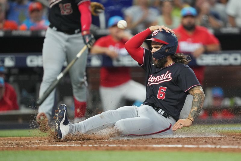 Aug 26, 2023; Miami, Florida, USA;  Washington Nationals pinch runner Michael Chavis (6) scores a run in the ninth inning against the Miami Marlins at loanDepot Park. Mandatory Credit: Jim Rassol-USA TODAY Sports