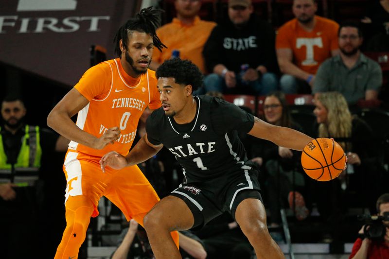 Jan 17, 2023; Starkville, Mississippi, USA; Mississippi State Bulldogs forward Tolu Smith (1) dribbles toward the basket as Tennessee Volunteers forward Jonas Aidoo (0) defends during the first half at Humphrey Coliseum. Mandatory Credit: Petre Thomas-USA TODAY Sports