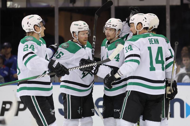 Feb 20, 2024; New York, New York, USA; Dallas Stars defenseman Miro Heiskanen (4) celebrates his goal against the New York Rangers with centers Roope Hintz (24) and Joe Pavelski (16) and left wing Jamie Benn (14) during the second period at Madison Square Garden. Mandatory Credit: Brad Penner-USA TODAY Sports