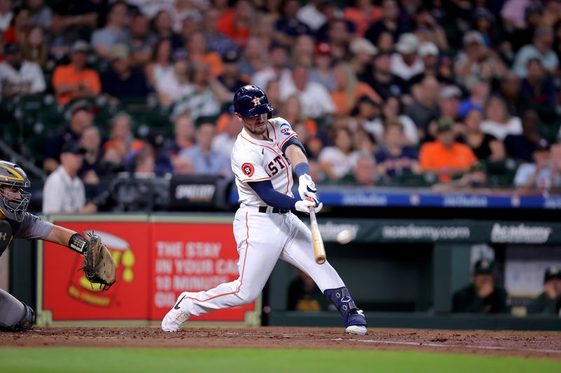 May 14, 2024; Houston, Texas, USA; Houston Astros third baseman Alex Bregman (2) hits a solo home run to left field against the Oakland Athletics during the second inning at Minute Maid Park. Mandatory Credit: Erik Williams-USA TODAY Sports