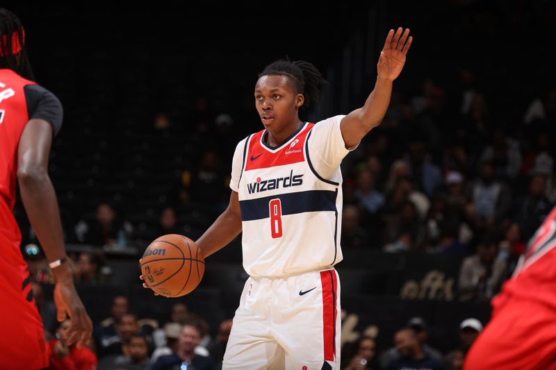 WASHINGTON, DC -? OCTOBER 11: Carlton Carrington #8 of the Washington Wizards dribbles the ball during the game against the Toronto Raptors during a NBA preseason game on October 11, 2024 at Capital One Arena in Washington, DC. NOTE TO USER: User expressly acknowledges and agrees that, by downloading and or using this Photograph, user is consenting to the terms and conditions of the Getty Images License Agreement. Mandatory Copyright Notice: Copyright 2024 NBAE (Photo by Stephen Gosling/NBAE via Getty Images)