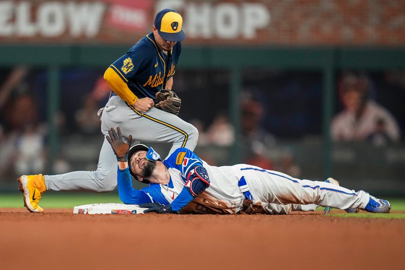 Jul 29, 2023; Cumberland, Georgia, USA; Atlanta Braves catcher Travis d'Arnaud (16) calls timeout after diving into second base under Milwaukee Brewers shortstop Willy Adames (27) after hitting a double during the seventh inning at Truist Park. Mandatory Credit: Dale Zanine-USA TODAY Sports