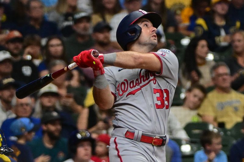 Sep 16, 2023; Milwaukee, Wisconsin, USA; Washington Nationals left fielder Jake Alu (39) drives in a run with a base hit in the eighth inning against the Milwaukee Brewers at American Family Field. Mandatory Credit: Benny Sieu-USA TODAY Sports