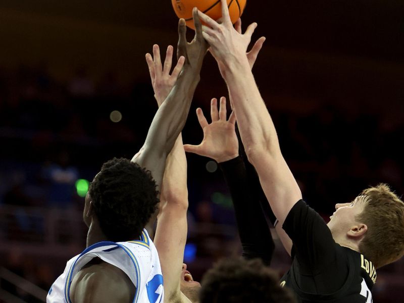 Jan 14, 2023; Los Angeles, California, USA;  UCLA Bruins forward Adem Bona (3) and Colorado Buffaloes center Lawson Lovering (34) fight for a rebound during the second half at Pauley Pavilion presented by Wescom. Mandatory Credit: Kiyoshi Mio-USA TODAY Sports