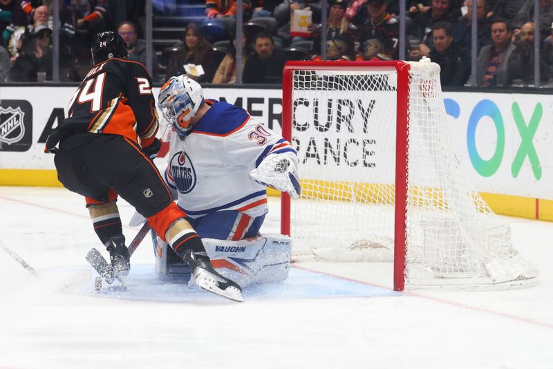 Feb 9, 2024; Anaheim, California, USA; Edmonton Oilers goaltender Calvin Pickard (30) makes a save against Anaheim Ducks center Bo Groulx (24) during the second period of a game at Honda Center. Mandatory Credit: Jessica Alcheh-USA TODAY Sports