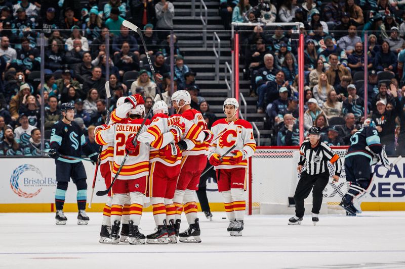 Oct 19, 2024; Seattle, Washington, USA; Calgary Flames center Blake Coleman (20) celebrates with teammates after scoring a goal against the Seattle Kraken during the first period at Climate Pledge Arena. Mandatory Credit: Caean Couto-Imagn Images