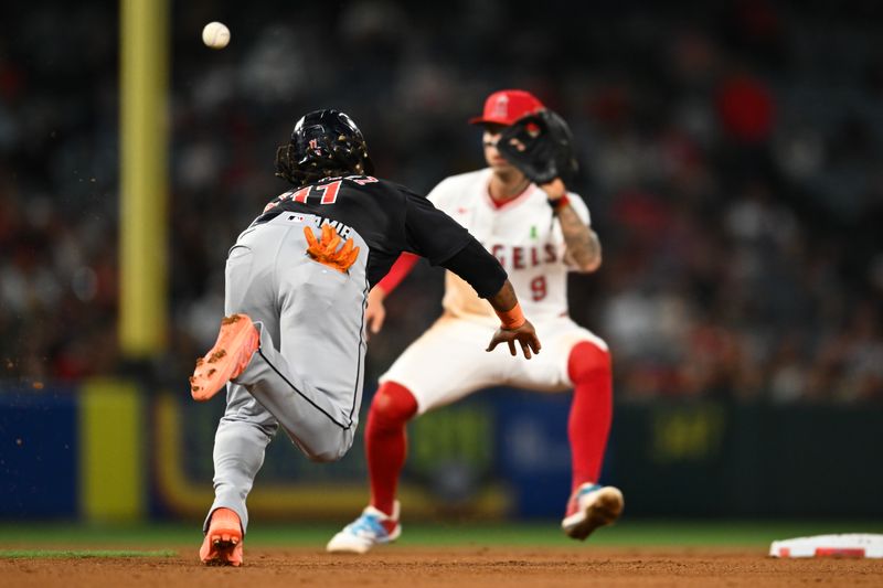 May 25, 2024; Anaheim, California, USA; Cleveland Guardians third baseman José Ramírez (11) attempts to steal second base against Los Angeles Angels shortstop Zach Neto (9) during the eighth inning at Angel Stadium. Mandatory Credit: Jonathan Hui-USA TODAY Sports