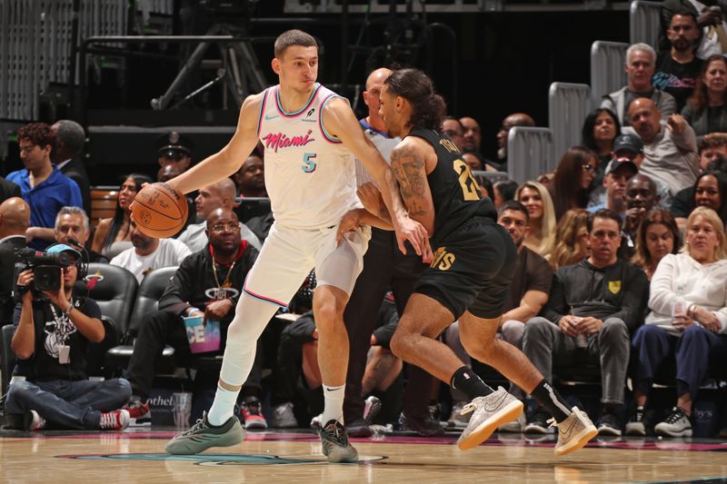MIAMI, FL - JANUARY 29: Nikola Jovic #5 of the Miami Heat handles the ball during the game against the Cleveland Cavaliers on January 29, 2025 at Kaseya Center in Miami, Florida. NOTE TO USER: User expressly acknowledges and agrees that, by downloading and or using this Photograph, user is consenting to the terms and conditions of the Getty Images License Agreement. Mandatory Copyright Notice: Copyright 2025 NBAE (Photo by Issac Baldizon/NBAE via Getty Images)