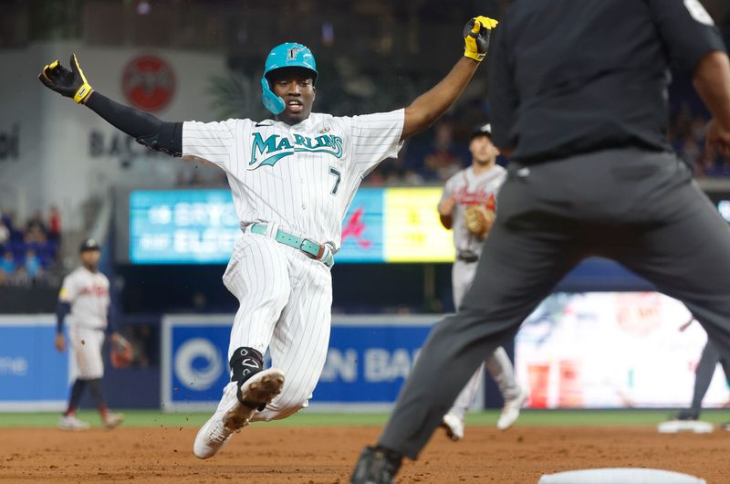 Sep 15, 2023; Miami, Florida, USA; Miami Marlins right fielder Jesus Sanchez (7) triples against the Atlanta Braves during the first inning at loanDepot Park. Mandatory Credit: Rhona Wise-USA TODAY Sports