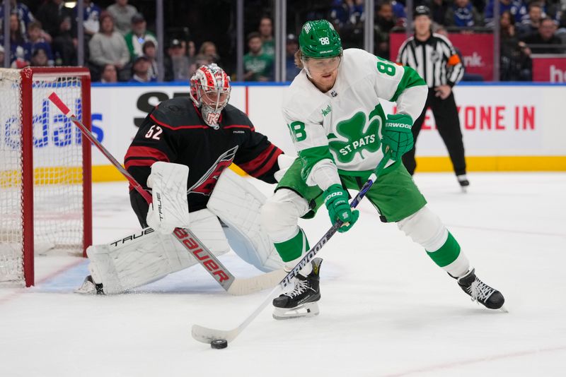 Mar 16, 2024; Toronto, Ontario, CAN; Toronto Maple Leafs forward William Nylander (88) controls the puck in front of Carolina Hurricanes goaltender Pyotr Kochetkov (52)  during the first period at Scotiabank Arena. Mandatory Credit: John E. Sokolowski-USA TODAY Sports