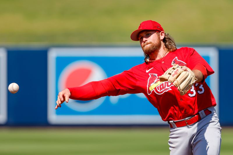 Feb 28, 2023; West Palm Beach, Florida, USA; St. Louis Cardinals second baseman Brendan Donovan (33) throws to first base to take out Washington Nationals designated hitter Matt Adams (not pictured) during the second inning at The Ballpark of the Palm Beaches. Mandatory Credit: Sam Navarro-USA TODAY Sports