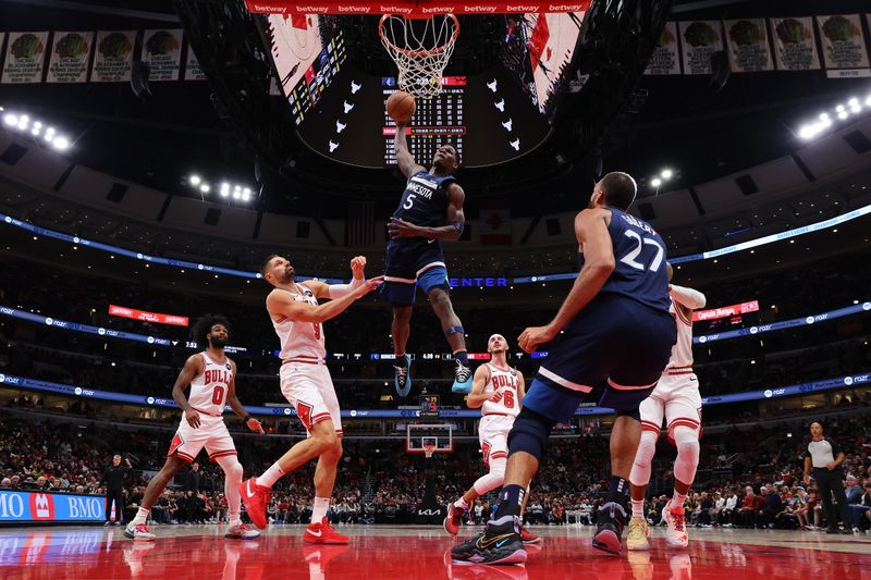 CHICAGO, ILLINOIS - OCTOBER 19: Anthony Edwards #5 of the Minnesota Timberwolves dunks against the Chicago Bulls during the first half of a preseason game at the United Center on October 19, 2023 in Chicago, Illinois. NOTE TO USER: User expressly acknowledges and agrees that, by downloading and or using this photograph, User is consenting to the terms and conditions of the Getty Images License Agreement.  (Photo by Michael Reaves/Getty Images)