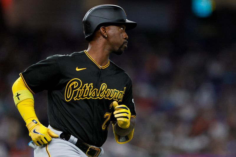 Jun 25, 2023; Miami, Florida, USA; Pittsburgh Pirates designated hitter Andrew McCutchen (22) runs toward first base after hitting a single against the Miami Marlins during the first inning at loanDepot Park. Mandatory Credit: Sam Navarro-USA TODAY Sports