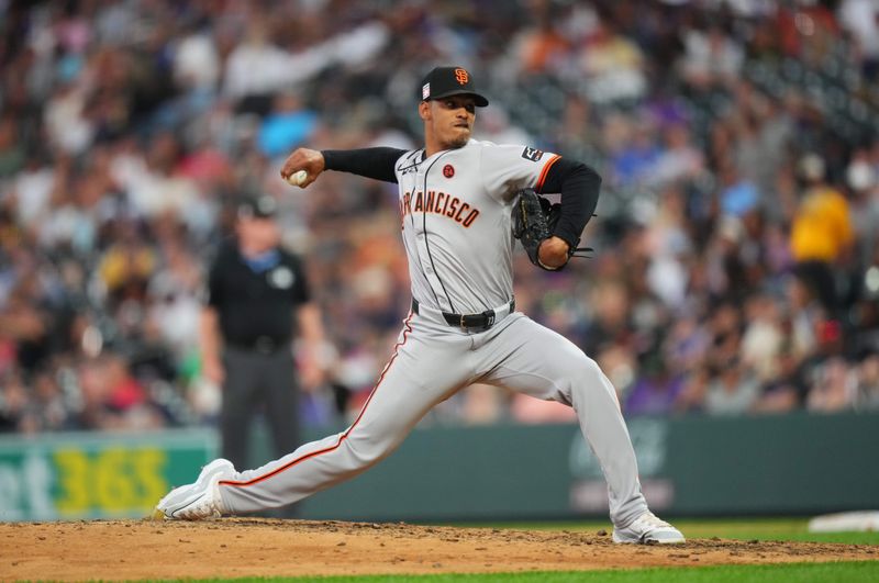 Jul 19, 2024; Denver, Colorado, USA; San Francisco Giants pitcher Randy Rodríguez (73) delivers a pitch in the sixth inning against the Colorado Rockies at Coors Field. Mandatory Credit: Ron Chenoy-USA TODAY Sports