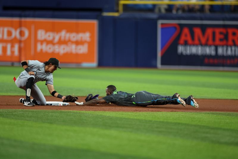 May 6, 2024; St. Petersburg, Florida, USA;  Tampa Bay Rays outfielder Randy Arozarena (56) steals second base against the Chicago White Sox in the fourth inning at Tropicana Field. Mandatory Credit: Nathan Ray Seebeck-USA TODAY Sports