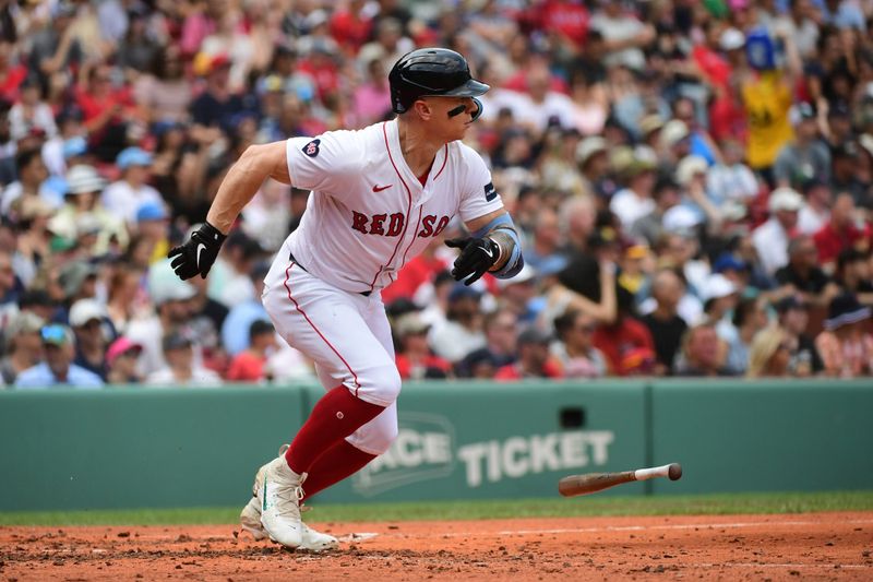 Jul 14, 2024; Boston, Massachusetts, USA;  Boston Red Sox left fielder Tyler O'Neill (17) hits a single during the third inning against the Kansas City Royals at Fenway Park. Mandatory Credit: Bob DeChiara-USA TODAY Sports