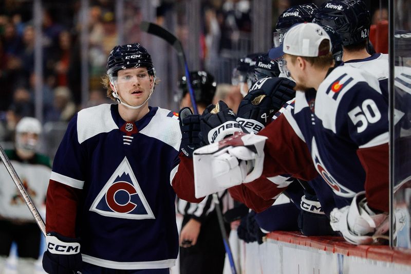 Dec 23, 2023; Denver, Colorado, USA; Colorado Avalanche defenseman Bowen Byram (4) celebrates with the bench after his goal in the first period against the Arizona Coyotes at Ball Arena. Mandatory Credit: Isaiah J. Downing-USA TODAY Sports