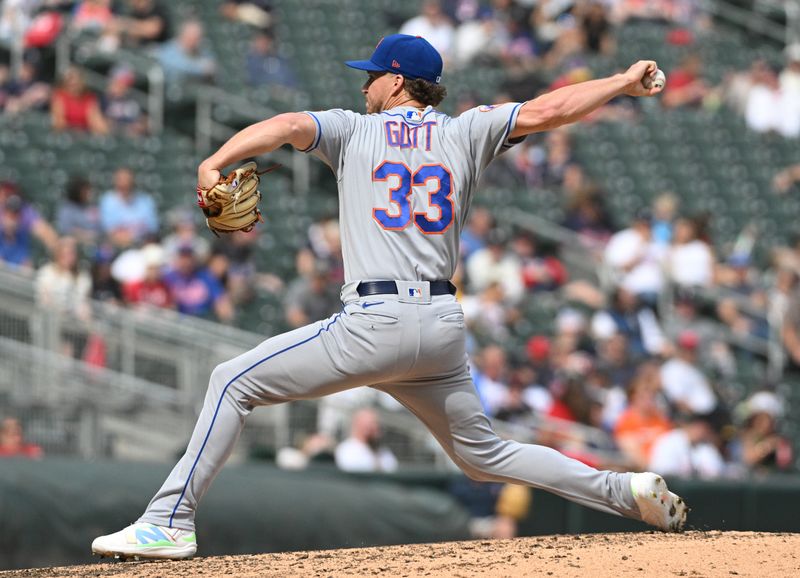 Sep 10, 2023; Minneapolis, Minnesota, USA; New York Mets relief pitcher Trevor Gott (33) delivers a pitch against the Minnesota Twins in the eighth inning at Target Field. Mandatory Credit: Michael McLoone-USA TODAY Sports