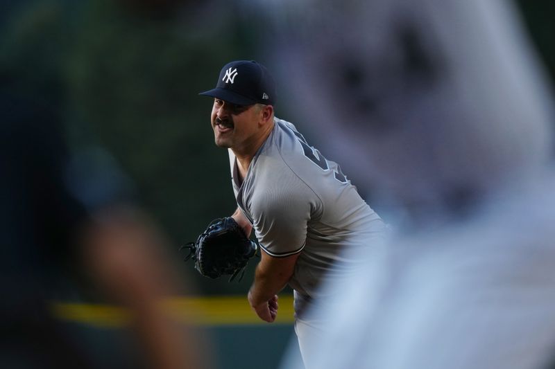 Jul 14, 2023; Denver, Colorado, USA; New York Yankees starting pitcher Carlos Rodon (55) delivers a pitch in the first inning against the Colorado Rockies at Coors Field. Mandatory Credit: Ron Chenoy-USA TODAY Sports