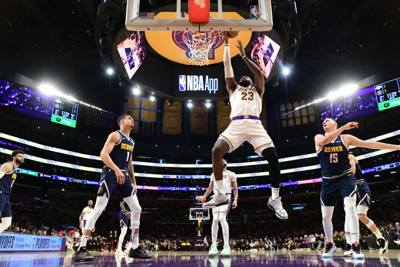 LOS ANGELES, CA - APRIL 27: LeBron James #23 of the Los Angeles Lakers drives to the basket during the game against the Denver Nuggets during Round 1 Game 4 of the 2024 NBA Playoffs on April 27, 2024 at Crypto.Com Arena in Los Angeles, California. NOTE TO USER: User expressly acknowledges and agrees that, by downloading and/or using this Photograph, user is consenting to the terms and conditions of the Getty Images License Agreement. Mandatory Copyright Notice: Copyright 2024 NBAE (Photo by Adam Pantozzi/NBAE via Getty Images)