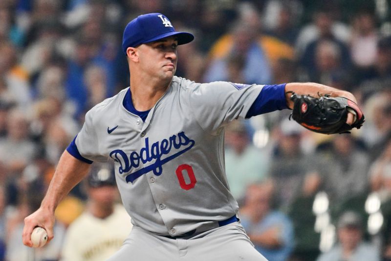 Aug 15, 2024; Milwaukee, Wisconsin, USA; Los Angeles Dodgers starting pitcher Jack Flaherty (0) throws against the Milwaukee Brewers in the first inning at American Family Field. Mandatory Credit: Benny Sieu-USA TODAY Sports