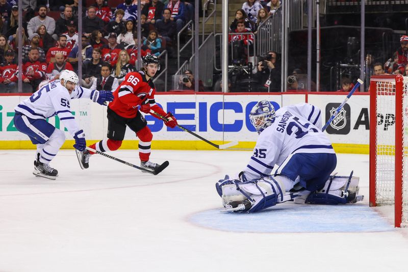 Mar 7, 2023; Newark, New Jersey, USA; Toronto Maple Leafs goaltender Ilya Samsonov (35) makes a save on New Jersey Devils center Jack Hughes (86) during the second period at Prudential Center. Mandatory Credit: Ed Mulholland-USA TODAY Sports