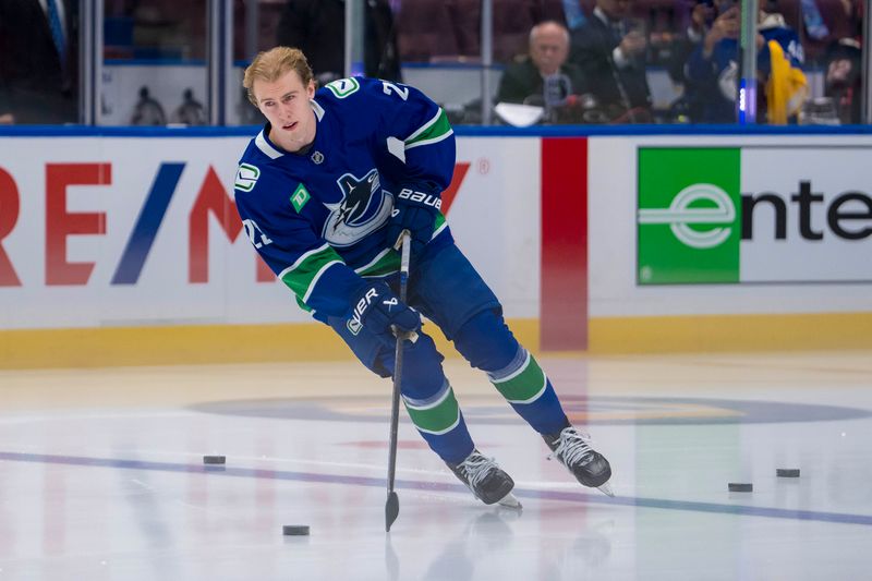 Nov 12, 2024; Vancouver, British Columbia, CAN; Vancouver Canucks forward Jonathan Lekkerimaki (23) warms up before his NHL debut against the Calgary Flames at Rogers Arena. Mandatory Credit: Bob Frid-Imagn Images