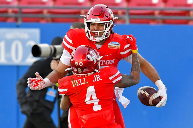 Dec 24, 2020; Frisco, Texas, USA;  Houston Cougars tight end Christian Trahan (85) and wide receiver Nathaniel Dell (4) celebrate a touchdown against Hawaii Warriors during the second half at Toyota Stadium. Mandatory Credit: Tim Flores-USA TODAY Sports