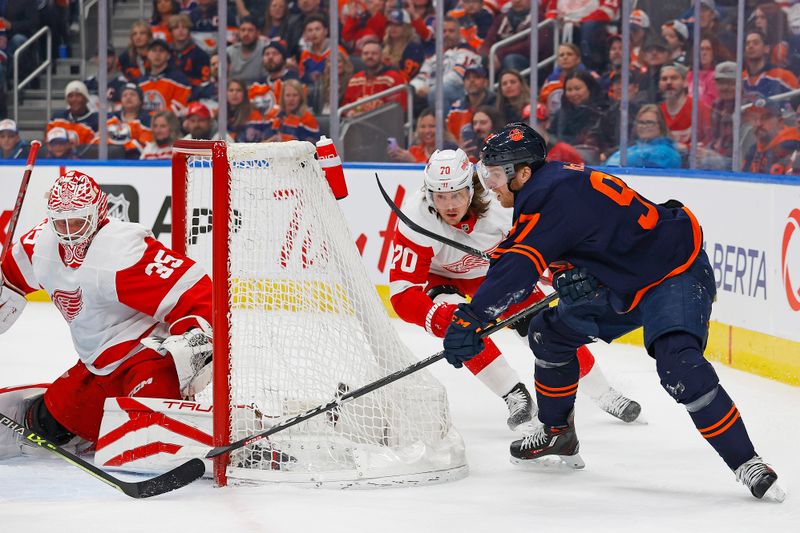 Feb 15, 2023; Edmonton, Alberta, CAN; Edmonton Oilers forward Connor McDavid (97) tries to get a puck past Detroit Red Wings goaltender Ville Husso (35) during the first period at Rogers Place. Mandatory Credit: Perry Nelson-USA TODAY Sports