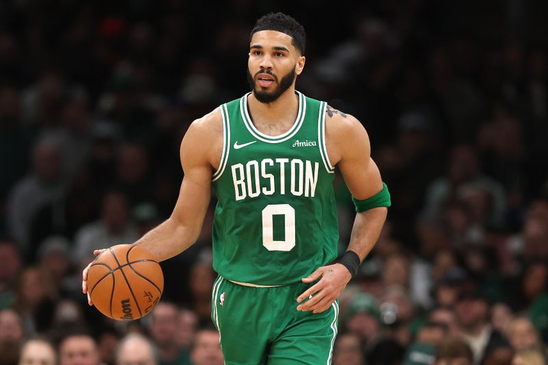 BOSTON, MASSACHUSETTS - FEBRUARY 23: Jayson Tatum #0 of the Boston Celtics dribbles downcourt against the New York Knicks  during the second half at TD Garden on February 23, 2025 in Boston, Massachusetts.  The Celtics defeat the Knicks 118-105. NOTE TO USER: User expressly acknowledges and agrees that, by downloading and or using this photograph, User is consenting to the terms and conditions of the Getty Images License Agreement.  (Photo by Maddie Meyer/Getty Images)