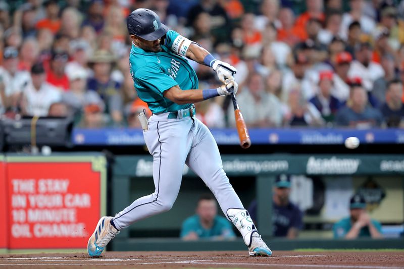 Aug 19, 2023; Houston, Texas, USA; Seattle Mariners center fielder Julio Rodriguez (44) hits a single against the Houston Astros during the first inning during the first inning at Minute Maid Park. Mandatory Credit: Erik Williams-USA TODAY Sports