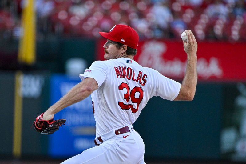 Aug 14, 2023; St. Louis, Missouri, USA;  St. Louis Cardinals starting pitcher Miles Mikolas (39) pitches against the Oakland Athletics during the first inning at Busch Stadium. Mandatory Credit: Jeff Curry-USA TODAY Sports