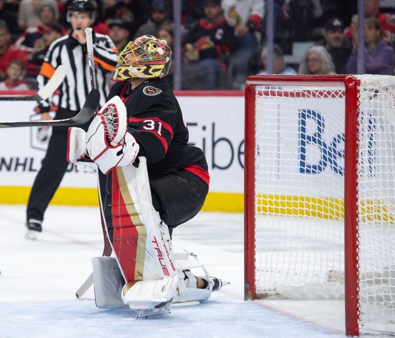 Dec 8, 2024; Ottawa, Ontario, CAN; Ottawa Senators goalie Anton Forsberg (31) makes a save in the second period against the New York Islanders at the Canadian Tire Centre. Mandatory Credit: Marc DesRosiers-Imagn Images