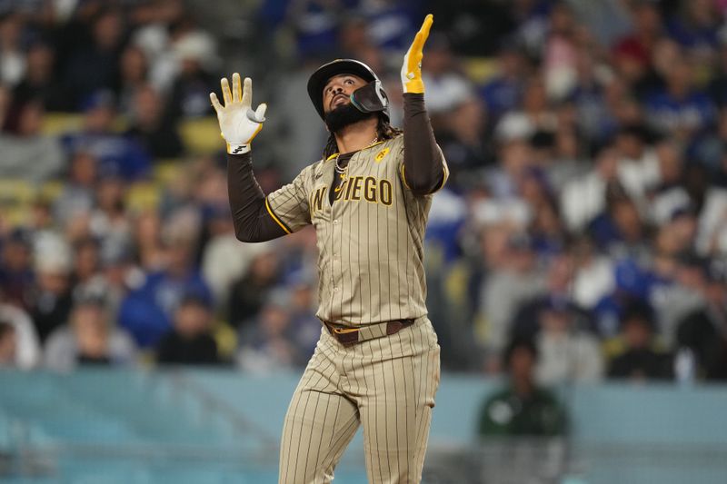 Sep 25, 2024; Los Angeles, California, USA;  San Diego Padres right fielder Fernando Tatis Jr. (23) celebrates after hitting a home run in the fifth inning against the Los Angeles Dodgers at Dodger Stadium. Mandatory Credit: Kirby Lee-Imagn Images