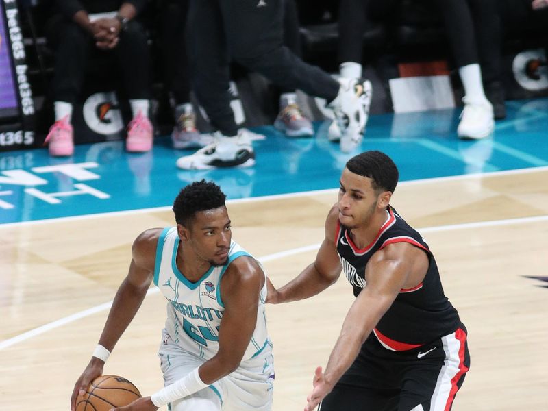 CHARLOTTE, NC - APRIL 3:  Brandon Miller #24 of the Charlotte Hornets handles the ball during the game giant the Portland Trail Blazers on April 3, 2024 at Spectrum Center in Charlotte, North Carolina. NOTE TO USER: User expressly acknowledges and agrees that, by downloading and or using this photograph, User is consenting to the terms and conditions of the Getty Images License Agreement.  Mandatory Copyright Notice:  Copyright 2024 NBAE (Photo by Brock Williams-Smith/NBAE via Getty Images)