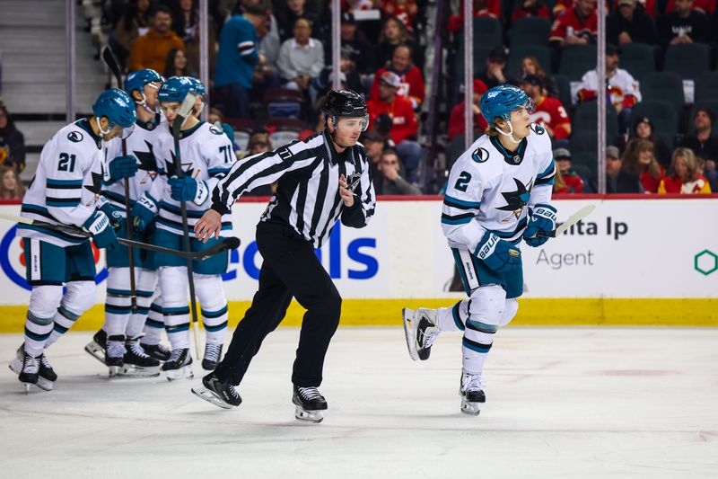 Jan 31, 2026; Calgary, Alberta, CAN; San Jose Sharks center Will Smith (2) celebrates his goal with teammates against the Calgary Flames during the first period at Scotiabank Saddledome. Mandatory Credit: Sergei Belski-Imagn Images