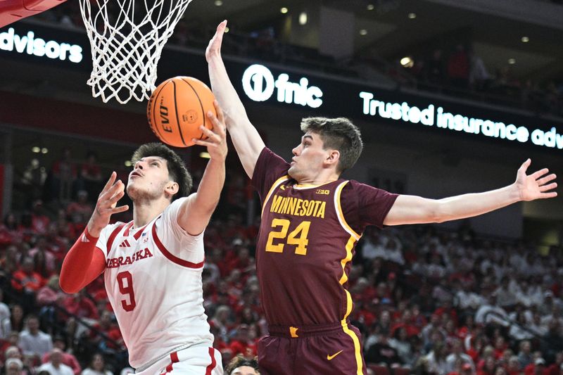 Mar 1, 2025; Lincoln, Nebraska, USA;  Minnesota Golden Gophers guard Mike Mitchell Jr. (2) defends a shot attempt from Nebraska Cornhuskers forward Berke Buyuktuncel (9) during the first half at Pinnacle Bank Arena. Mandatory Credit: Steven Branscombe-Imagn Images