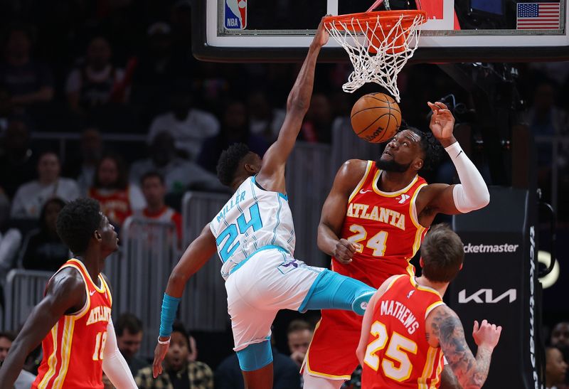 ATLANTA, GEORGIA - APRIL 10:  Brandon Miller #24 of the Charlotte Hornets dunks against Bruno Fernando #24 of the Atlanta Hawks during the second quarter at State Farm Arena on April 10, 2024 in Atlanta, Georgia.  NOTE TO USER: User expressly acknowledges and agrees that, by downloading and/or using this photograph, user is consenting to the terms and conditions of the Getty Images License Agreement.  (Photo by Kevin C. Cox/Getty Images)