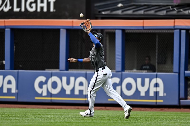 May 11, 2024; New York City, New York, USA; New York Mets outfielder Starling Marte (6) catches a fly ball for an out against the Atlanta Braves during the third inning at Citi Field. Mandatory Credit: John Jones-USA TODAY Sports