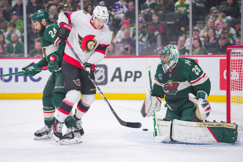 Apr 2, 2024; Saint Paul, Minnesota, USA; Ottawa Senators left wing Dominik Kubalik (81) tips the puck against the Minnesota Wild goaltender Marc-Andre Fleury (29) in the first period at Xcel Energy Center. Mandatory Credit: Brad Rempel-USA TODAY Sports