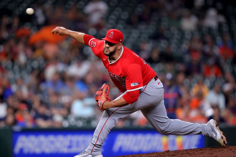 May 20, 2024; Houston, Texas, USA; Los Angeles Angels relief pitcher Carlos Estevez (53) delivers a pitch against the Houston Astros during the ninth inning at Minute Maid Park. Mandatory Credit: Erik Williams-USA TODAY Sports