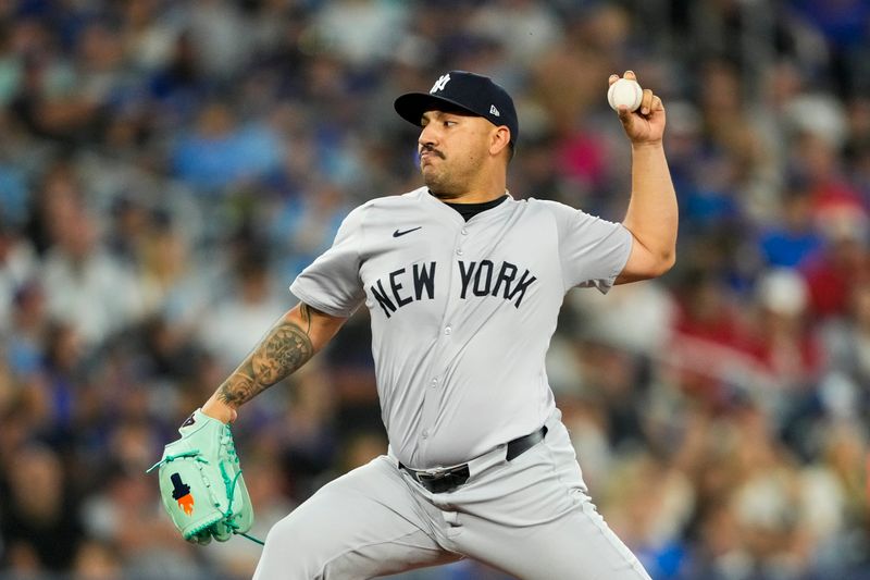 Jun 29, 2024; Toronto, Ontario, CAN; New York Yankees pitcher Nestor Cortes (65) pitches against the Toronto Blue Jays during the first inning at Rogers Centre. Mandatory Credit: Kevin Sousa-USA TODAY Sports