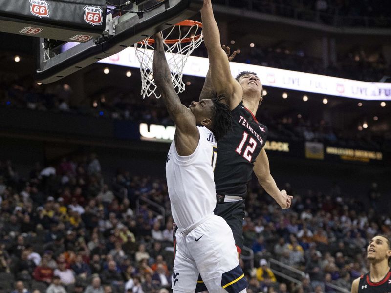 Mar 8, 2023; Kansas City, MO, USA; West Virginia Mountaineers guard Kedrian Johnson (0) shoots the ball while defended by Texas Tech Red Raiders forward Daniel Batcho (12) in the second half at T-Mobile Center. Mandatory Credit: Amy Kontras-USA TODAY Sports