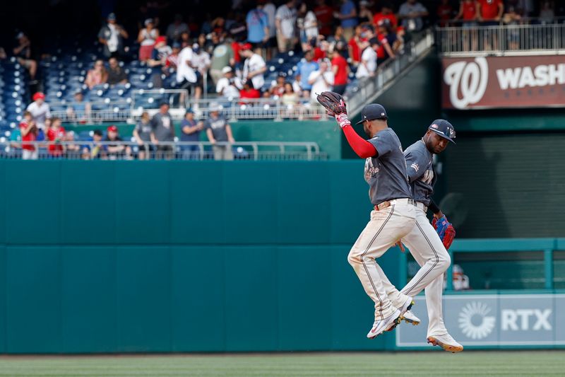 May 25, 2024; Washington, District of Columbia, USA; Washington Nationals second baseman Luis García Jr. (2) celebrates with Nationals outfielder Victor Robles (16) after their game against the Seattle Mariners at Nationals Park. Mandatory Credit: Geoff Burke-USA TODAY Sports