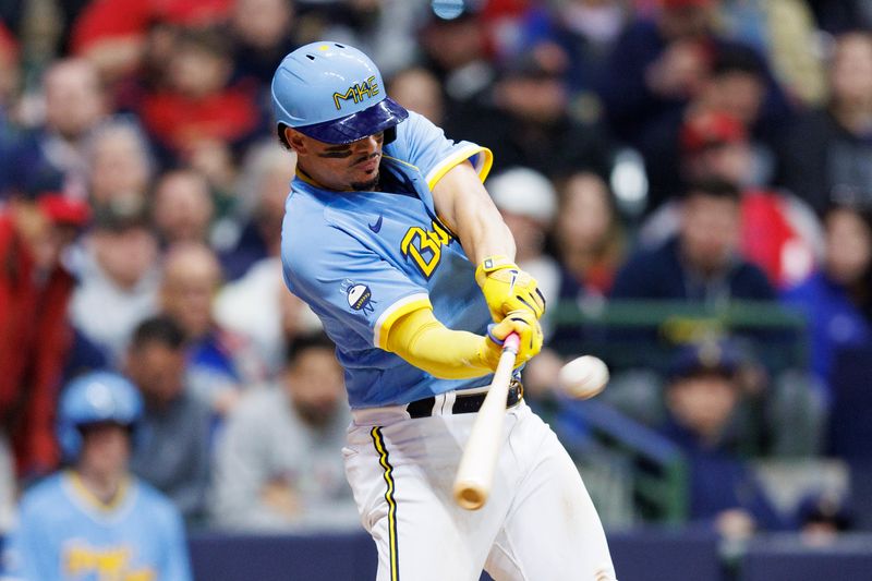 Apr 7, 2023; Milwaukee, Wisconsin, USA;  Milwaukee Brewers shortstop Willy Adames (27) hits a home run during the seventh inning against the St. Louis Cardinals at American Family Field. Mandatory Credit: Jeff Hanisch-USA TODAY Sports