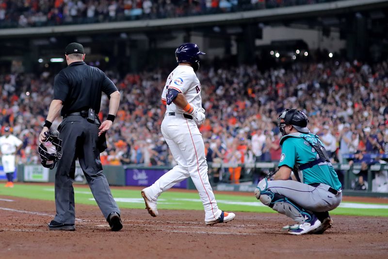 May 5, 2024; Houston, Texas, USA; Houston Astros first baseman Jon Singleton (28) crosses home plate after hitting a two-run home run to right field against the Seattle Mariners during the seventh inning at Minute Maid Park. Mandatory Credit: Erik Williams-USA TODAY Sports