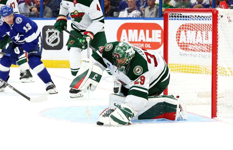 Oct 24, 2024; Tampa, Florida, USA; Minnesota Wild goaltender Marc-Andre Fleury (29) makes a save against the Tampa Bay Lightning during the third period at Amalie Arena. Mandatory Credit: Kim Klement Neitzel-Imagn Images