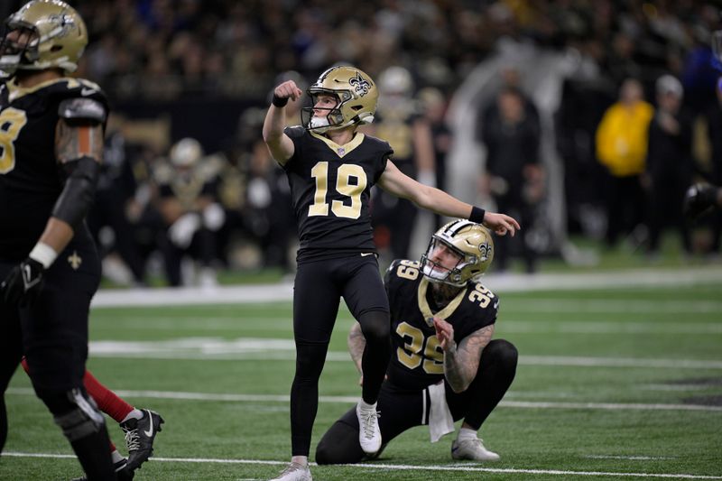 New Orleans Saints place-kicker Blake Grupen (19) watches his 50-yard field goal during the second half of an NFL football game against the New York Giants Sunday, Dec. 17, 2023, in New Orleans. (AP Photo/Matthew Hinton)